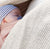 child in nesting days carrier